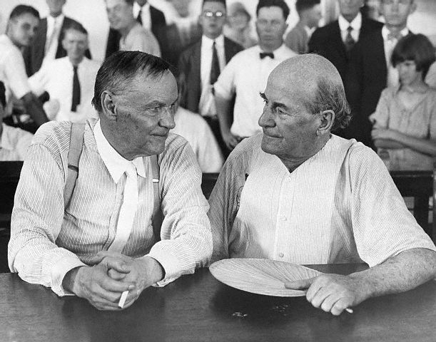 Clarence Darrow, a famous Chicago lawyer, and William Jennings Bryan, defender of Fundamentalism, have a friendly chat in a courtroom during the Scopes evolution trial. Darrow defended John T. Scopes, a biology teacher, who decided to test the new Tenessee law banning the teaching of evolution. Bryan took the stand for the prosecution as a bible expert. The trial in 1925 ended in conviction of Scopes. ca. 1925 Dayton, Tennessee, USA